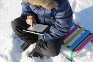 boy outdoors with tablet PC